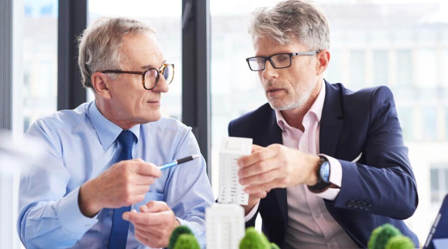 Two business men discussing the importance of finding the right investment partners.